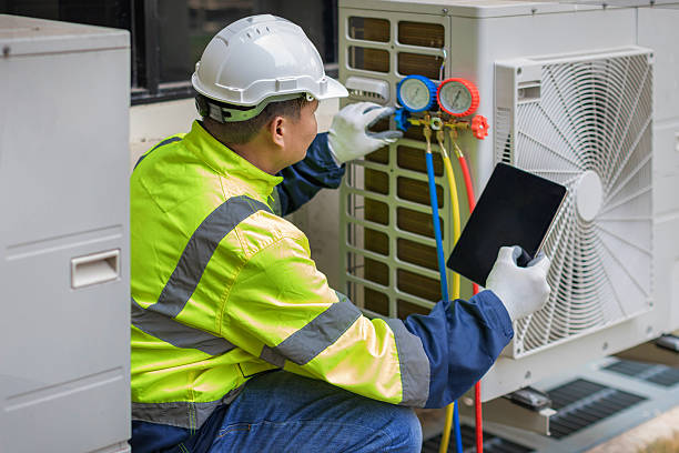 Professional Ac Installation technician working in Raynham Center, MA